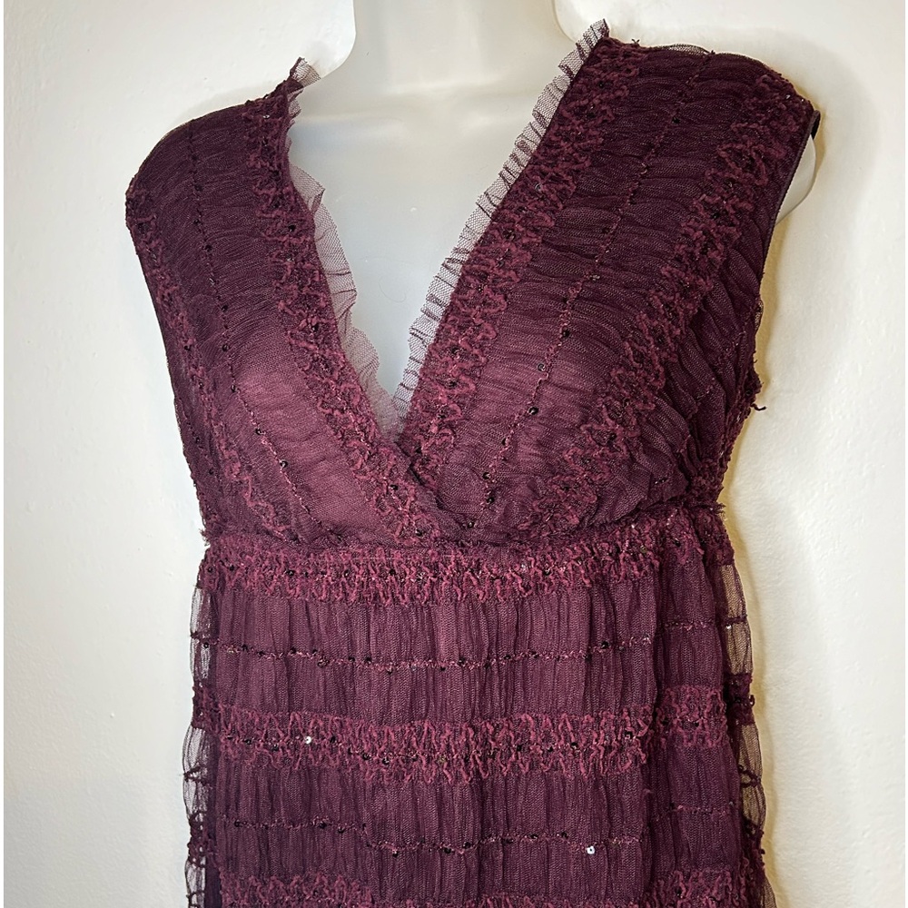 Sequined top with plugging neckline. With just enough sequence!